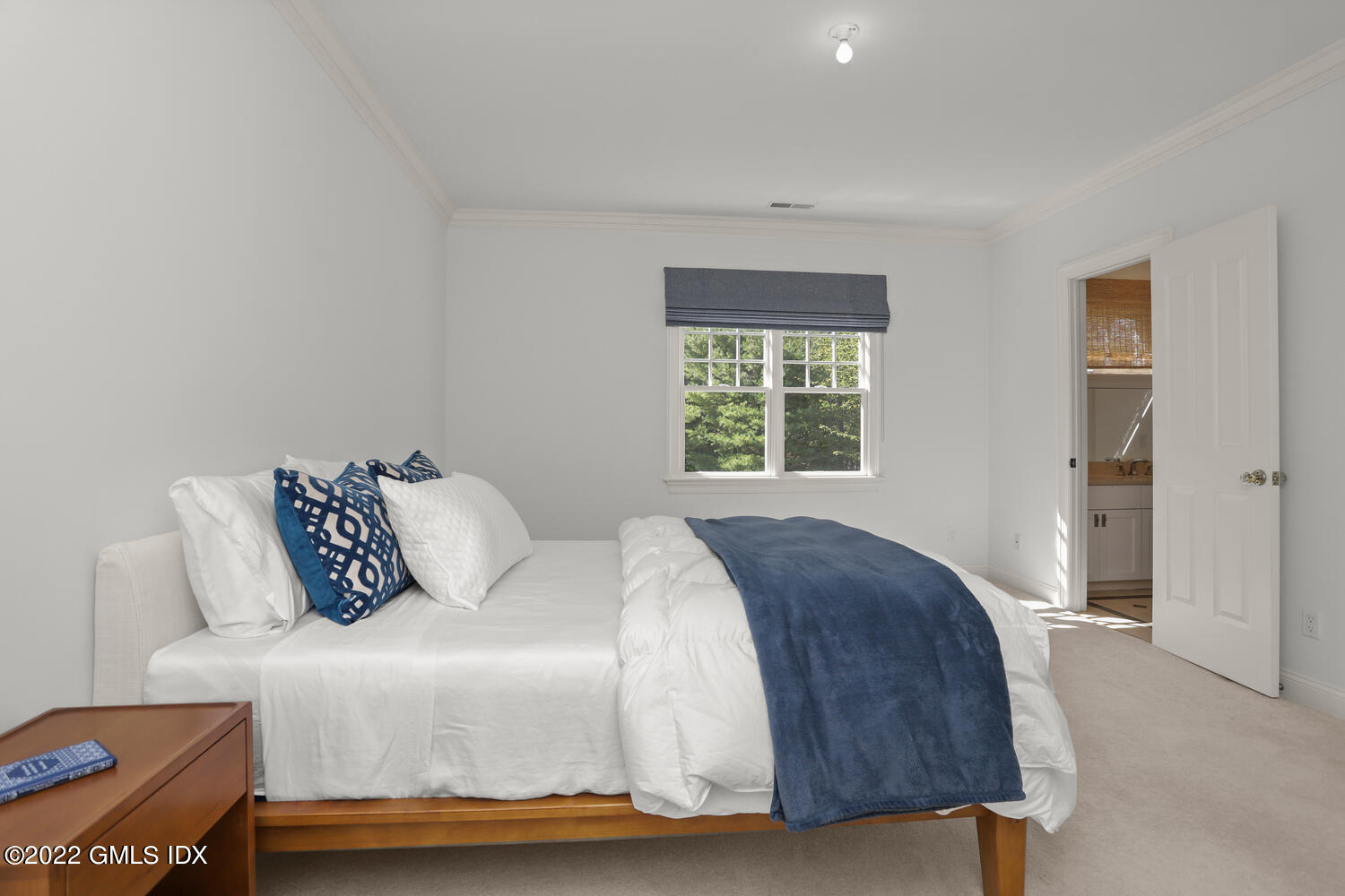 434 Cognewaugh Road Cos Cob, CT 06807 - Photo 22 of 47 a bedroom with a bed and a night stand