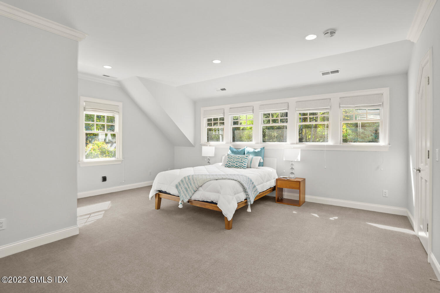 434 Cognewaugh Road Cos Cob, CT 06807 - Photo 23 of 47 a spacious bedroom with a bed and a window
