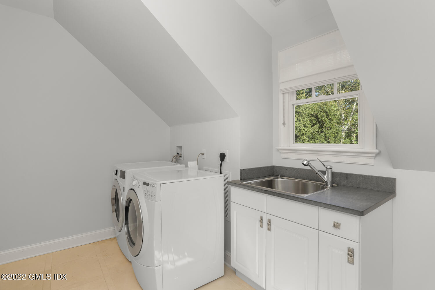 434 Cognewaugh Road Cos Cob, CT 06807 - Photo 25 of 47 a kitchen with a sink and cabinets
