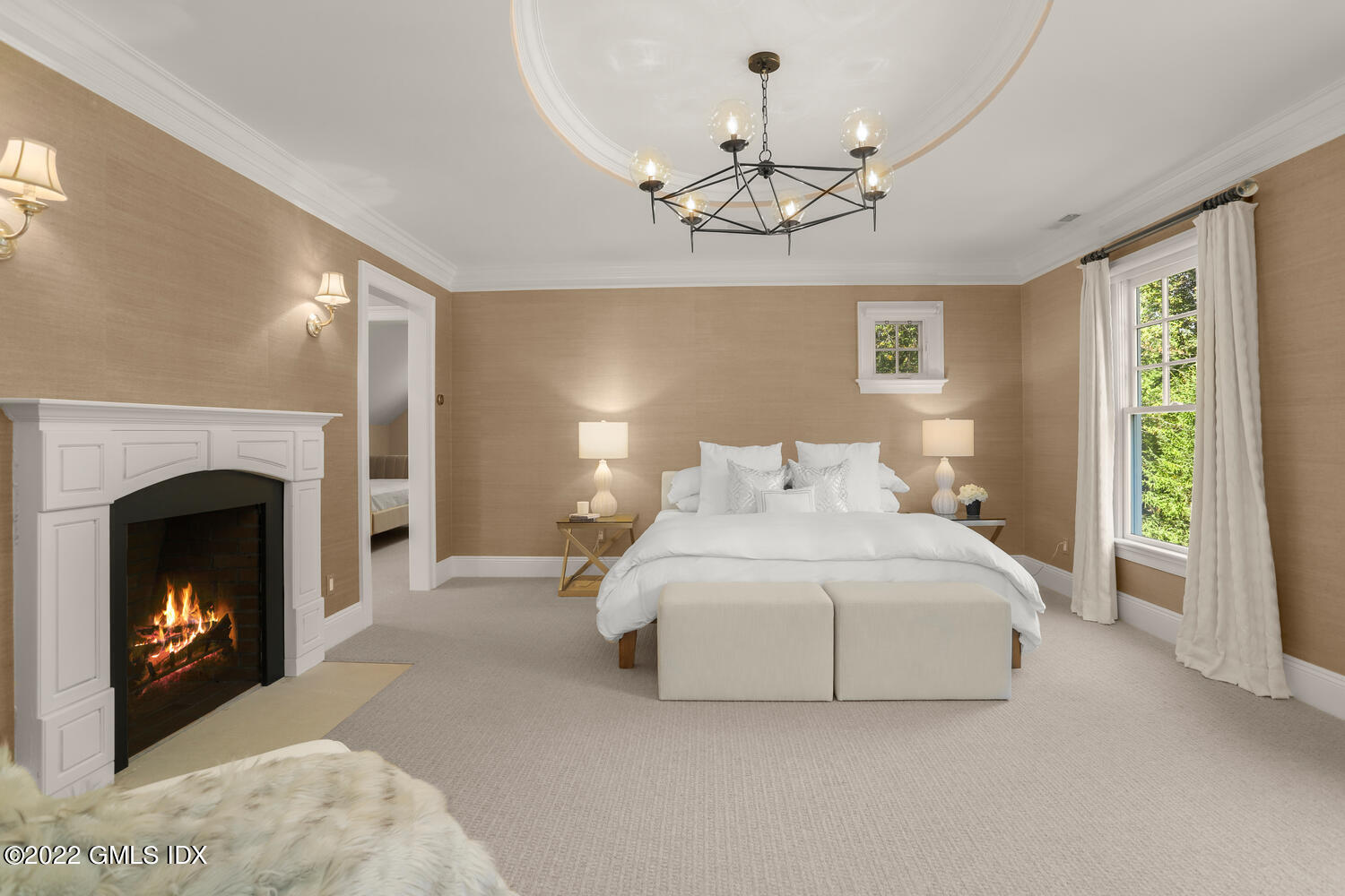 434 Cognewaugh Road Cos Cob, CT 06807 - Photo 29 of 47 a spacious bedroom with a bed and a fireplace