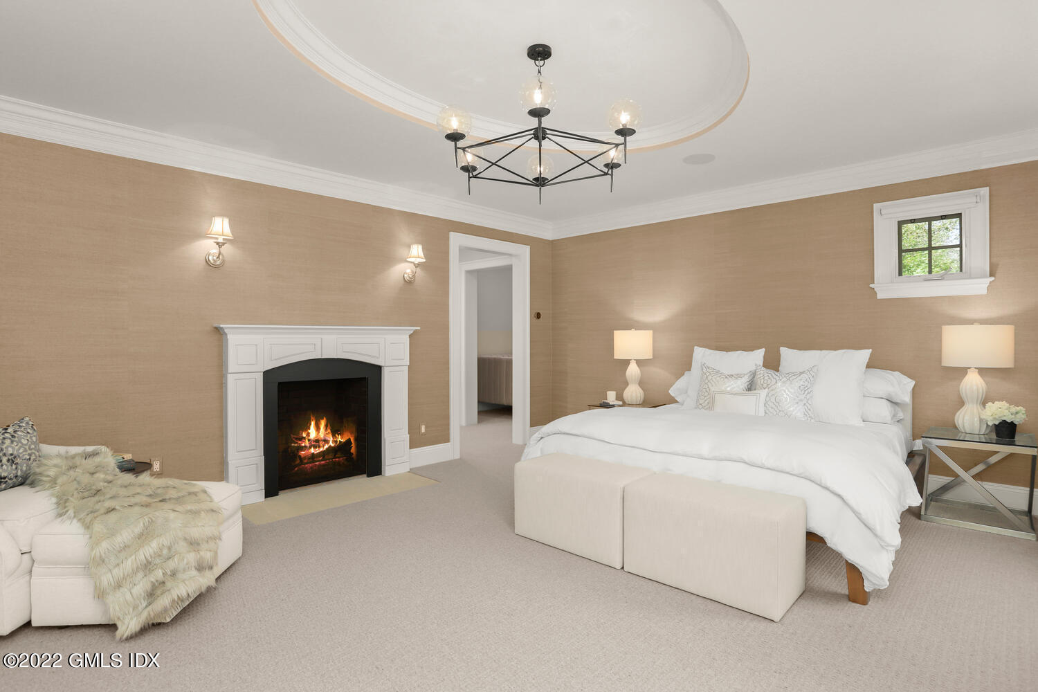 434 Cognewaugh Road Cos Cob, CT 06807 - Photo 30 of 47 a bedroom with a bed and a fireplace