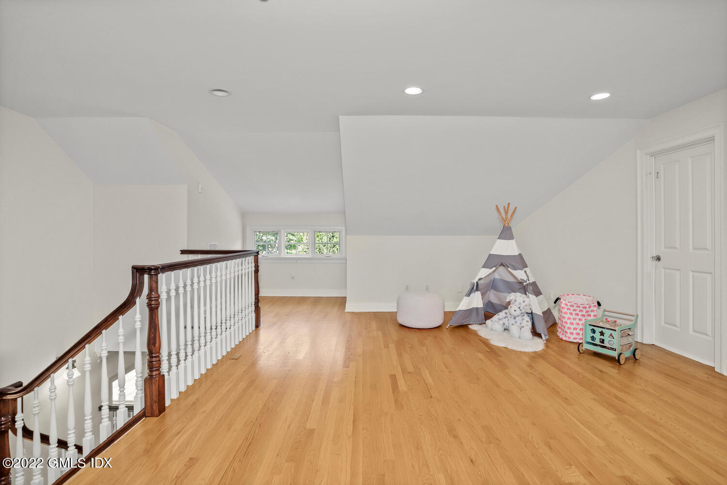 434 Cognewaugh Road Cos Cob, CT 06807 - Photo 34 of 47 a view of a room with wooden floor and stairs