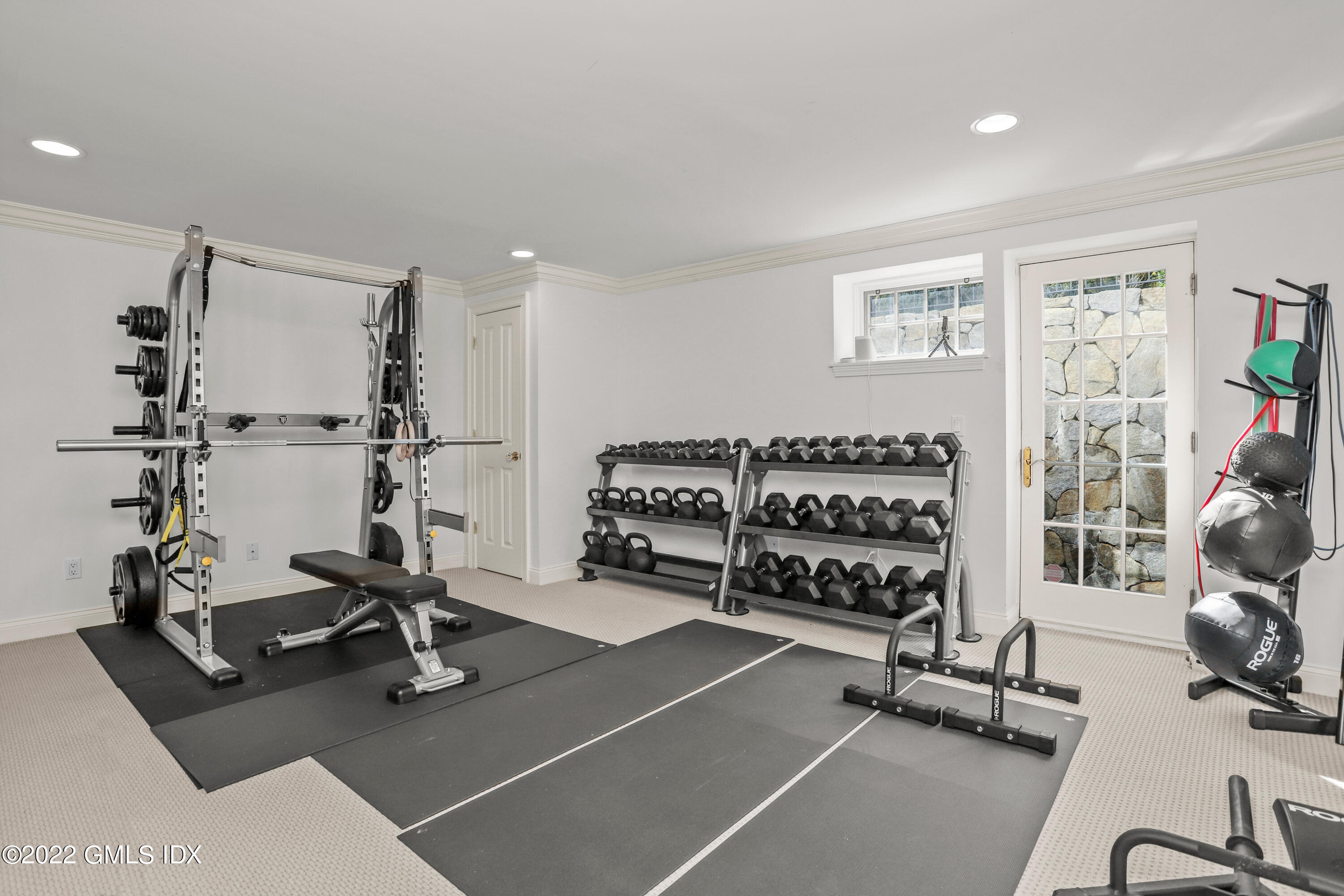 434 Cognewaugh Road Cos Cob, CT 06807 - Photo 37 of 47 a room with gym equipment and a large window