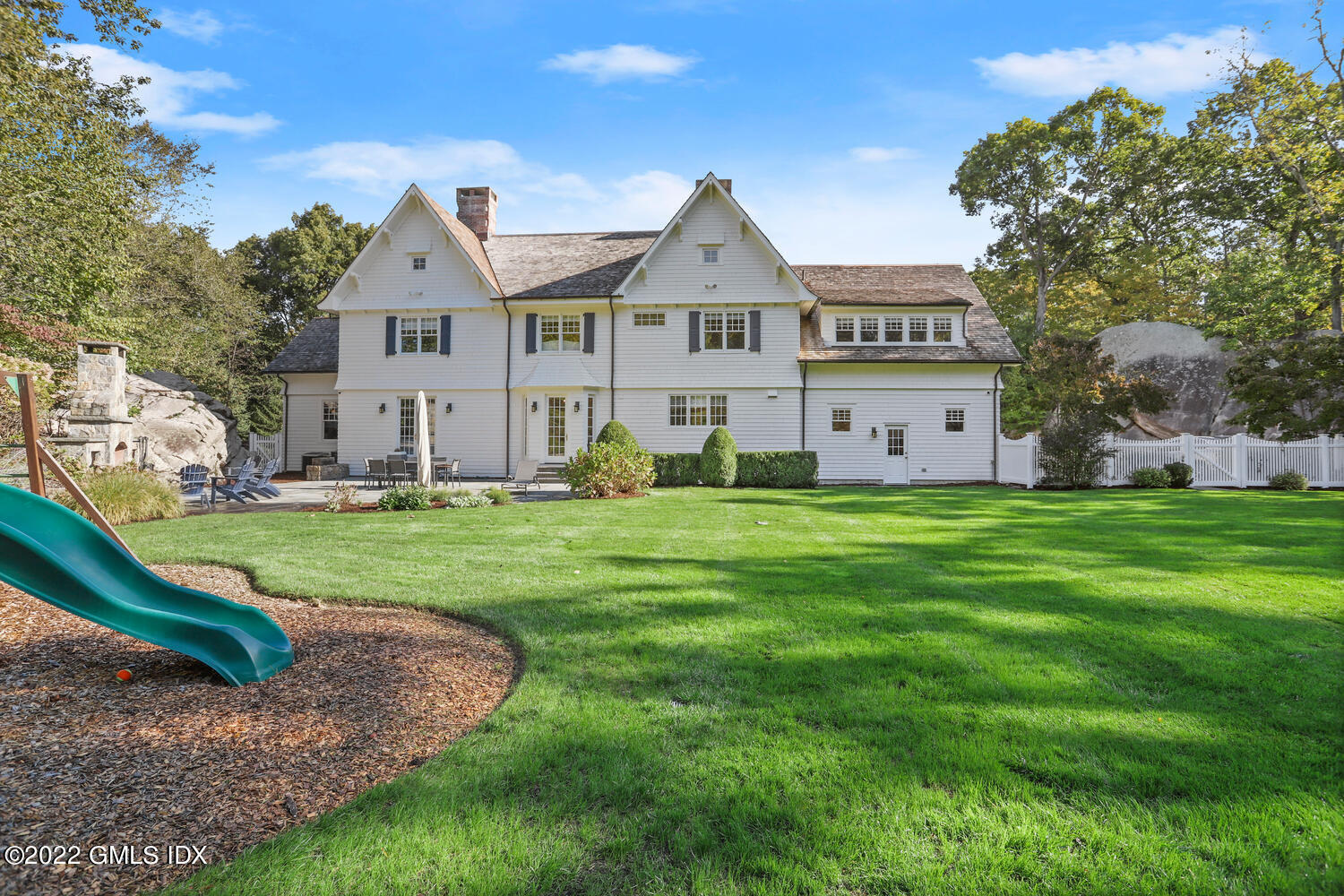 434 Cognewaugh Road Cos Cob, CT 06807 - Photo 42 of 47 a front view of a house with a yard and trees