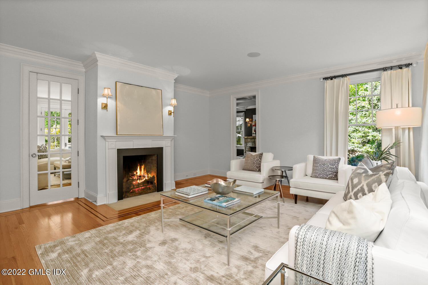 434 Cognewaugh Road Cos Cob, CT 06807 - Photo 5 of 47 a living room with furniture and a fireplace