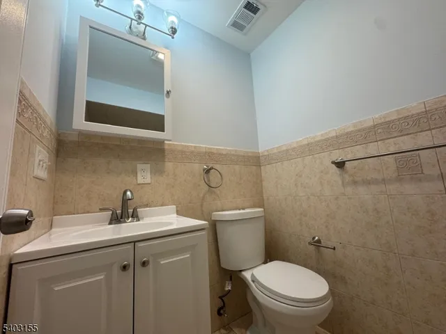 a bathroom with a sink toilet and vanity