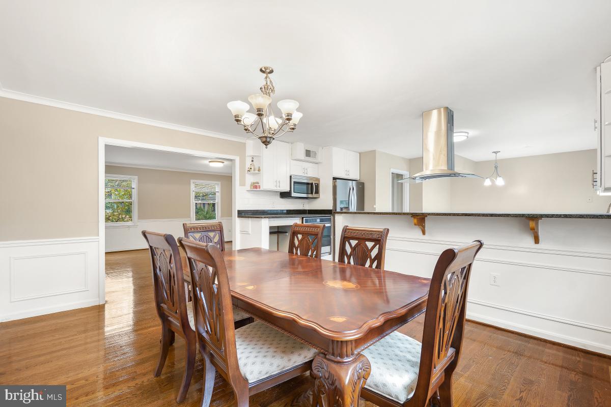 6871 Churchill Road McLean, VA 22101 - Photo 7 of 30 a view of a dining room with furniture and wooden floor