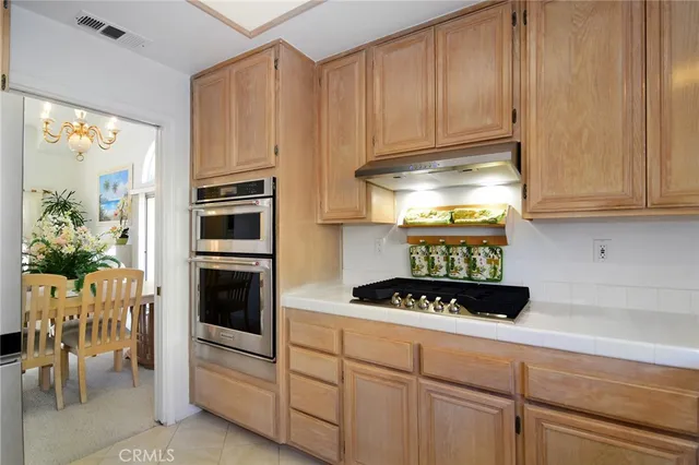 a kitchen with cabinets and appliances