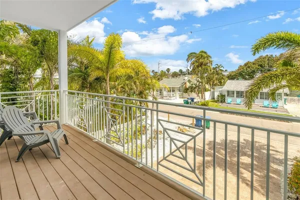 a view of a balcony with chairs