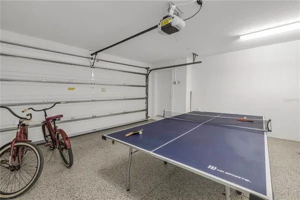 a room with table and white walls