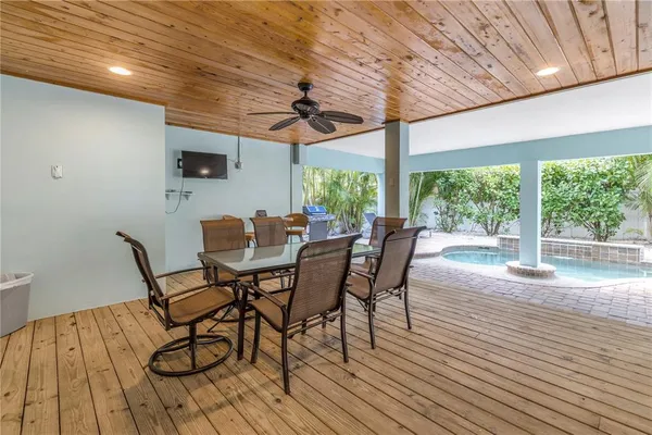 a dining room with furniture window and wooden floor
