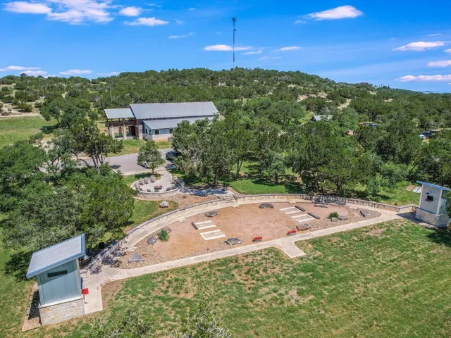 a view of a backyard with a garden and entertaining space