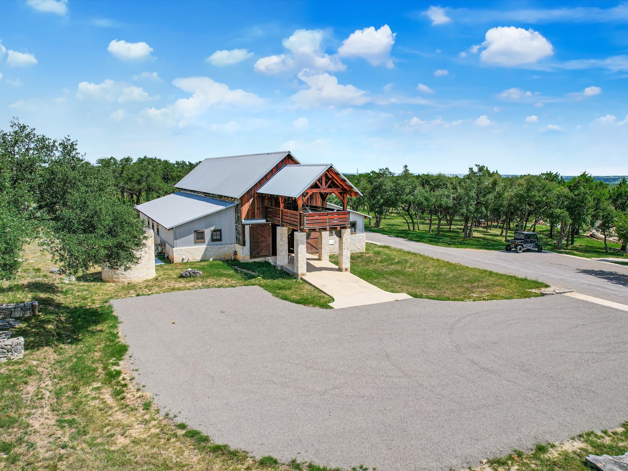 453 Lone Man Mountain Road Wimberley, TX 78676 - Photo 5 of 39 a front view of house with yard and green space