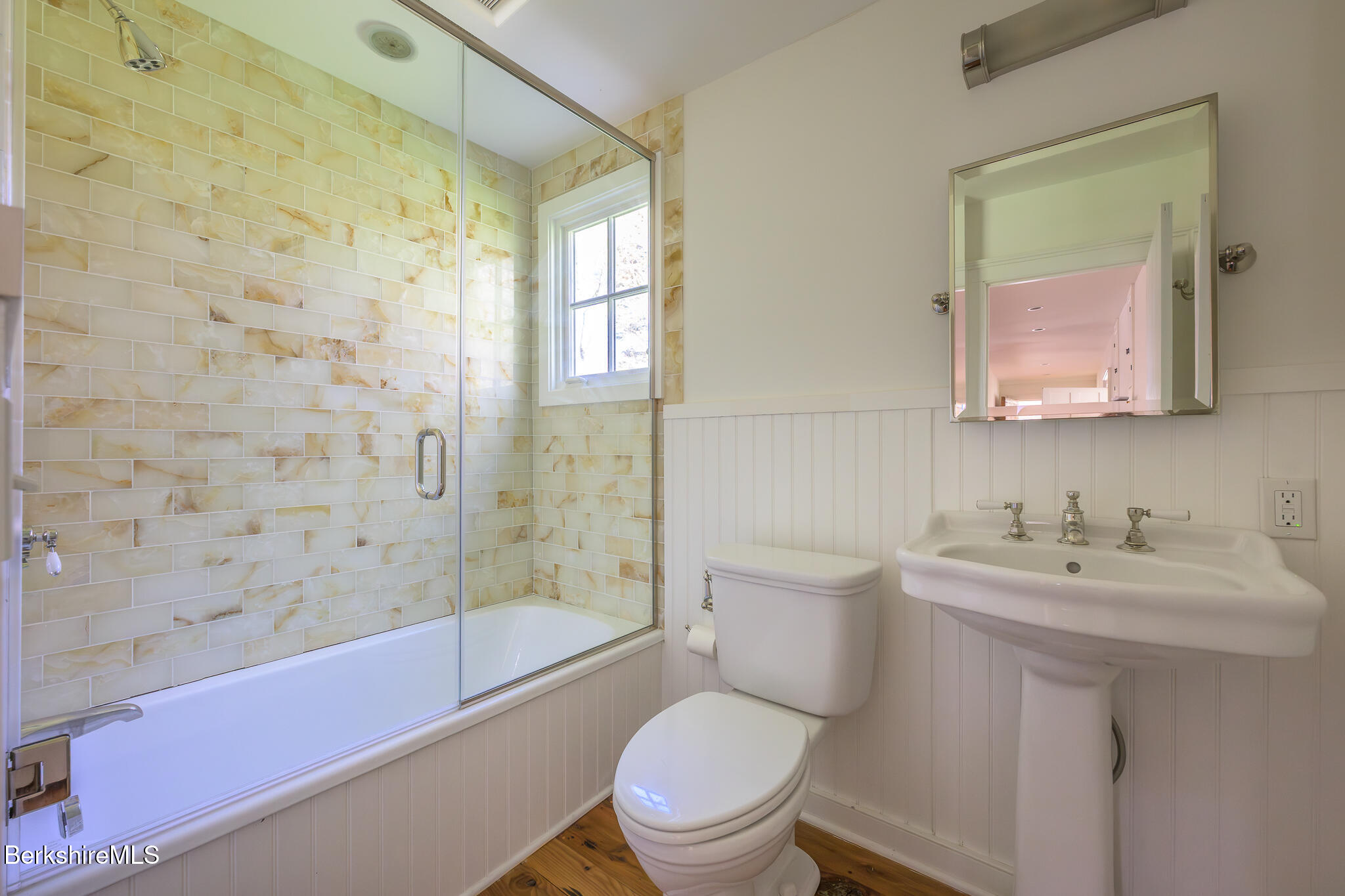 304 Hickey Hill Road Sheffield, MA 01257 - Photo 27 of 60 a bathroom with a toilet a sink a mirror a bathtub and shower