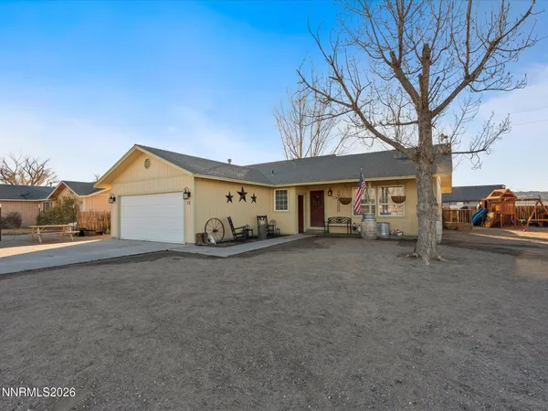 a view of a house with a yard and garage
