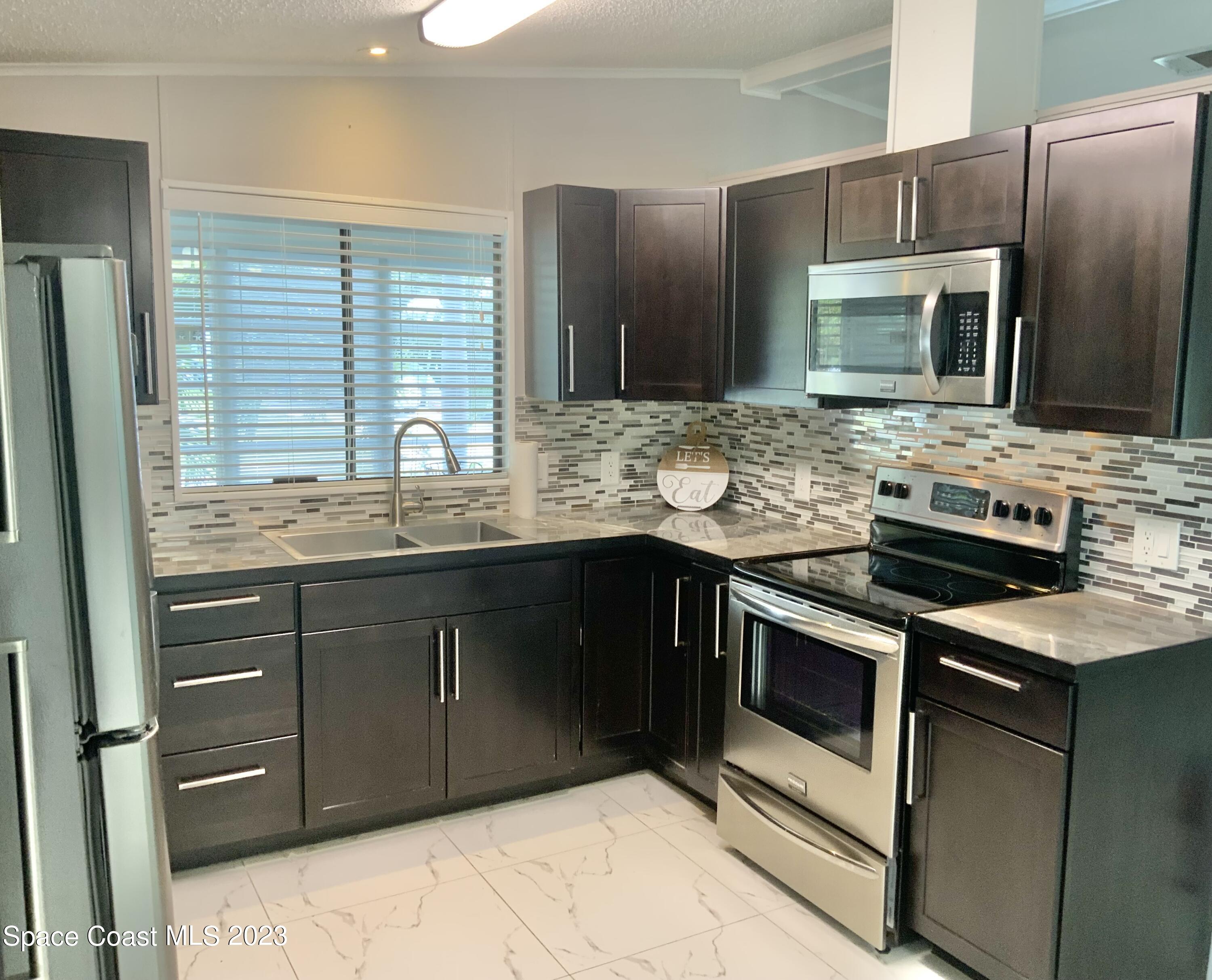 2310 Coconut Palm Drive Palm Bay, FL 32905 - Photo 8 of 22 IMG_4335