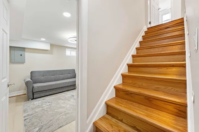a view of entryway and hall with wooden floor