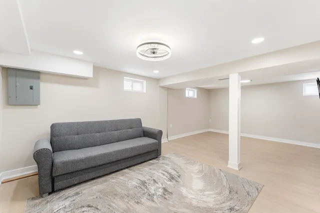 a living room with furniture and a rug