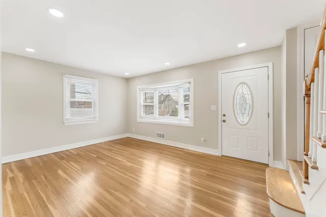 a view of empty room with windows