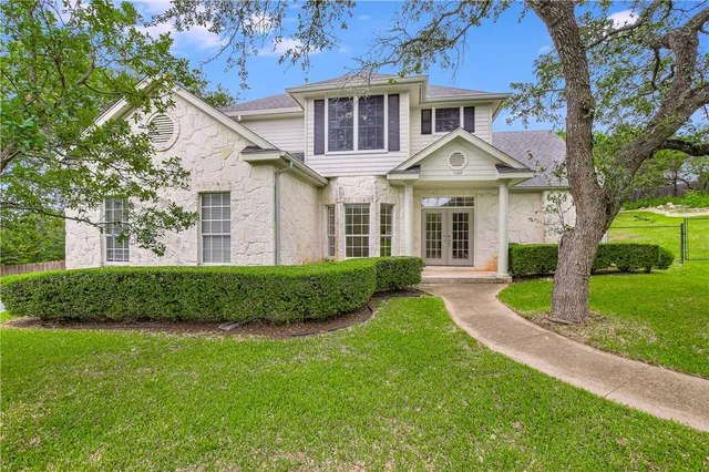 front view of a house and a yard