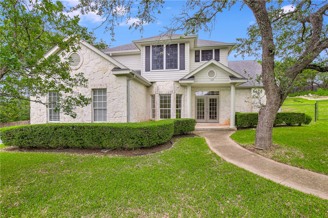 front view of a house and a yard