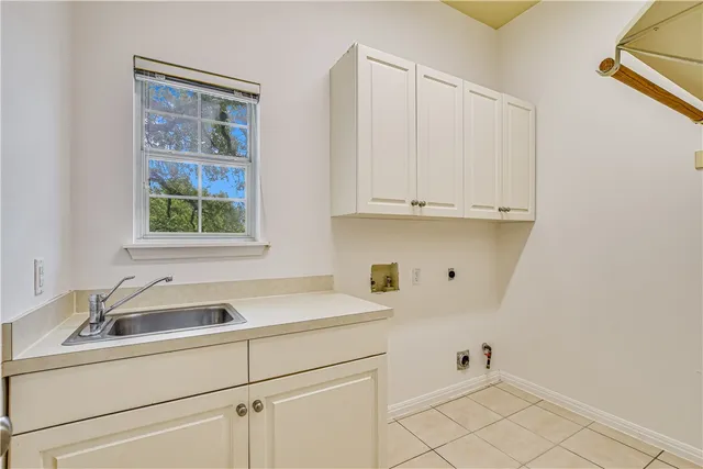 a view white cabinets and a sink window