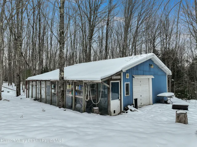 a view of a house with a patio and balcony