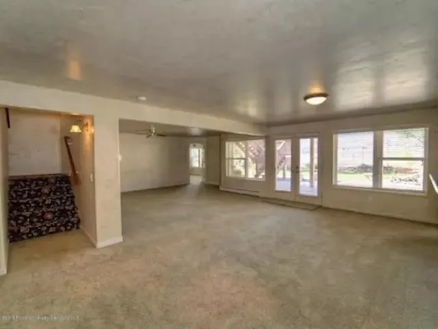 a view of an empty room with a window