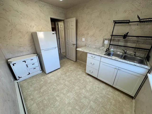 a room with cabinets and wooden floor
