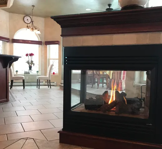 a view of a living room and dining room with wooden floor