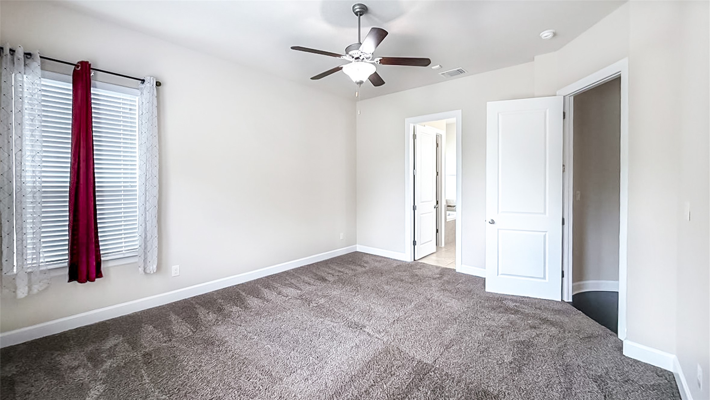 184 Fort Cobb Way Georgetown, TX 78628 - Photo 27 of 33 an empty room with windows and fan