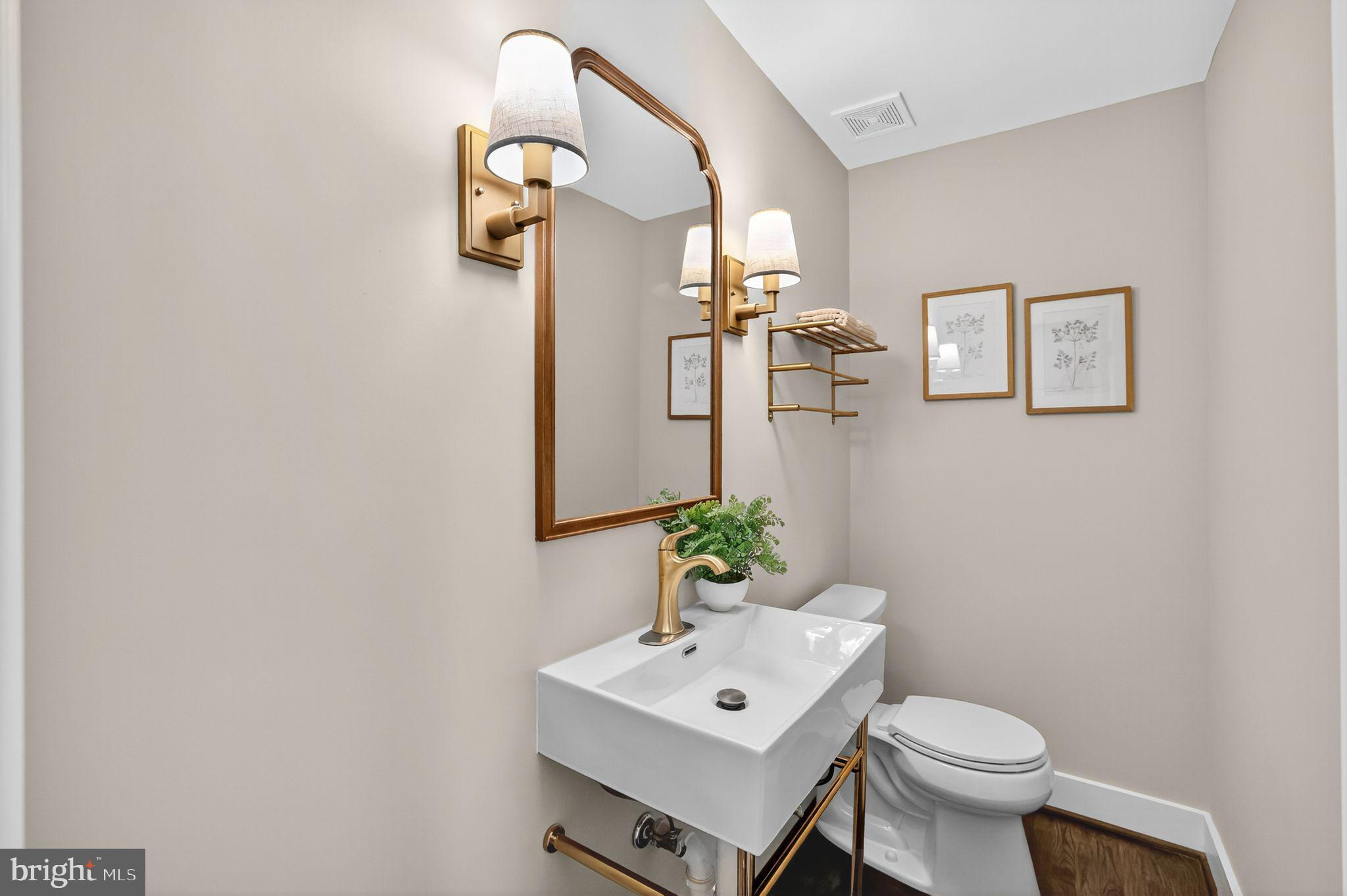 3428 Beret Lane Silver Spring, MD 20906 - Photo 13 of 33 a bathroom with a toilet a sink and mirror