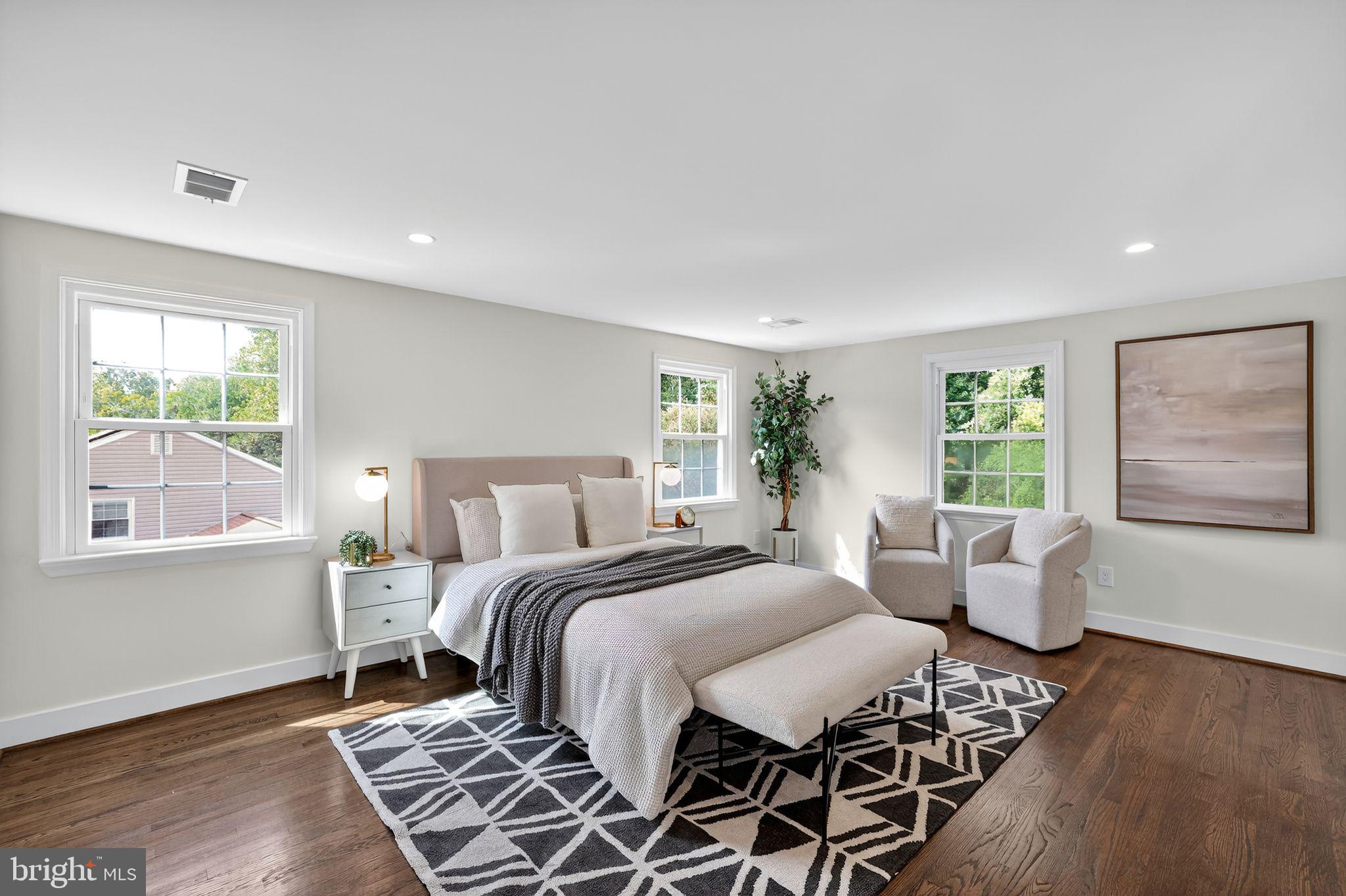 3428 Beret Lane Silver Spring, MD 20906 - Photo 17 of 33 a bedroom with a bed and wooden floor