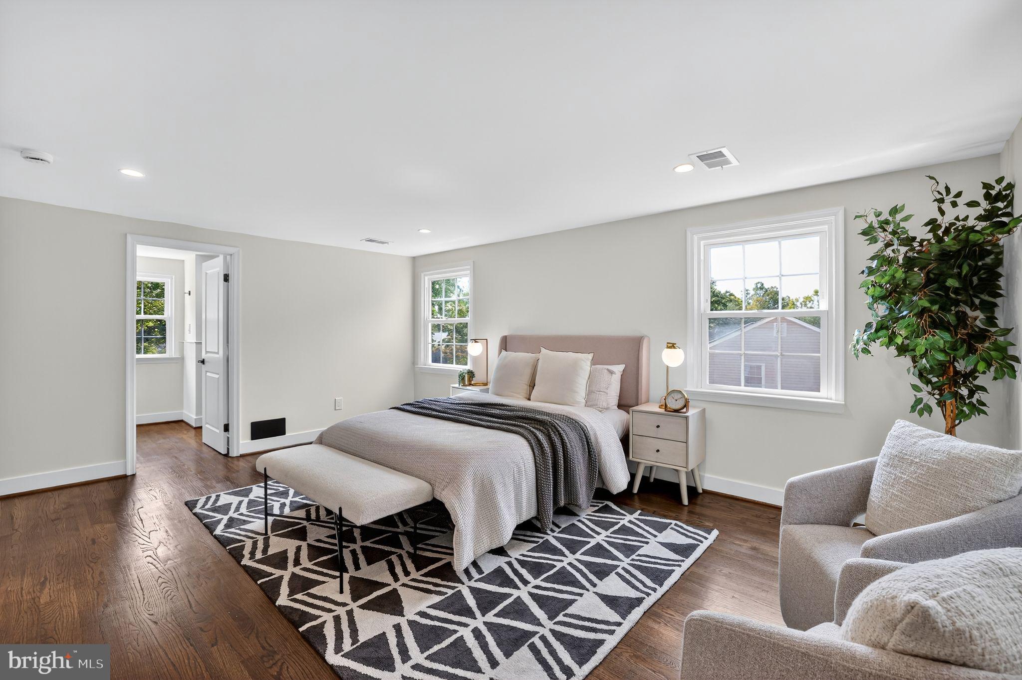 3428 Beret Lane Silver Spring, MD 20906 - Photo 18 of 33 a bedroom with a bed and wooden floor