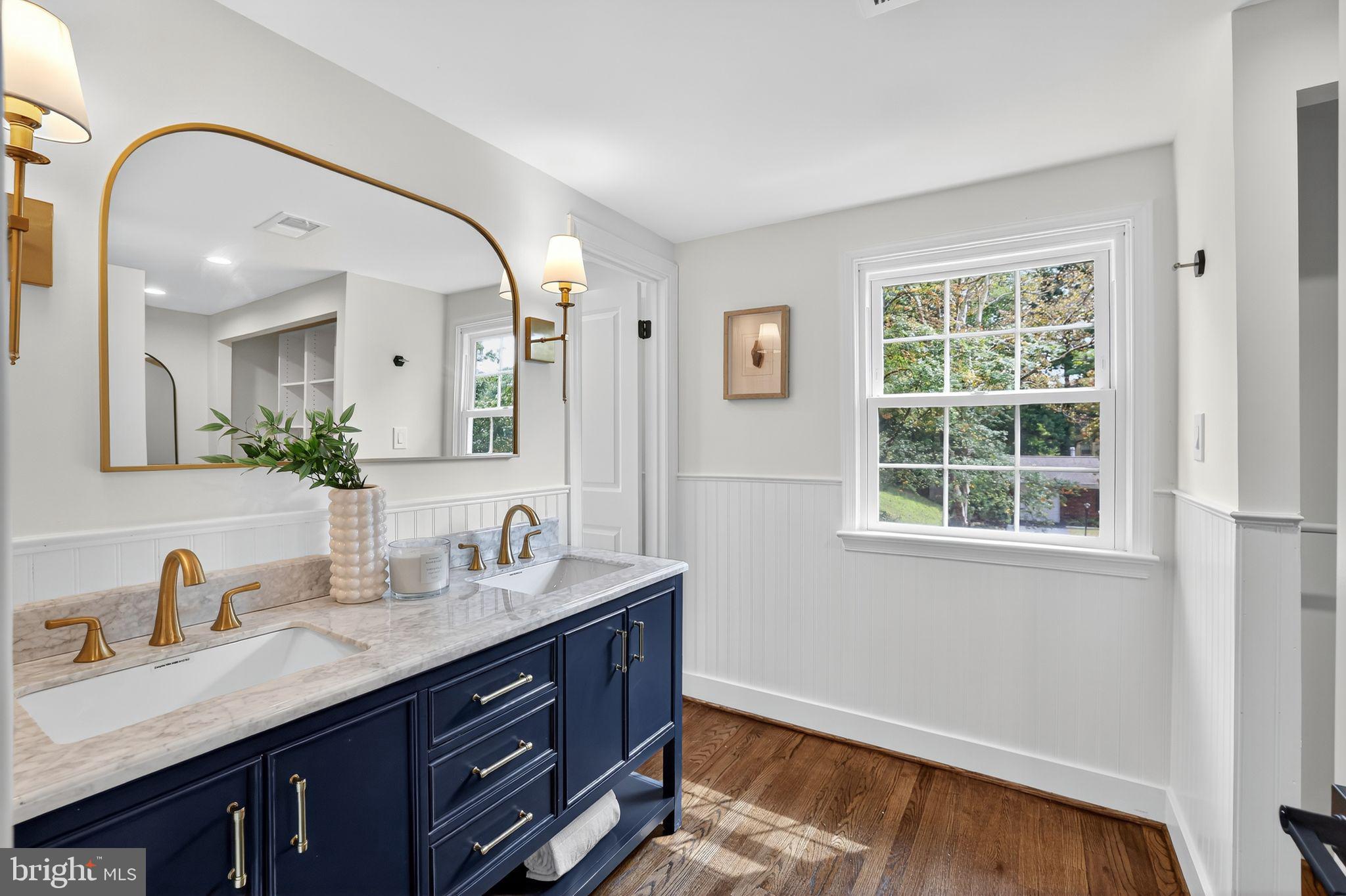 3428 Beret Lane Silver Spring, MD 20906 - Photo 19 of 33 a en suite bathroom with a granite countertop double vanity sink and a mirror