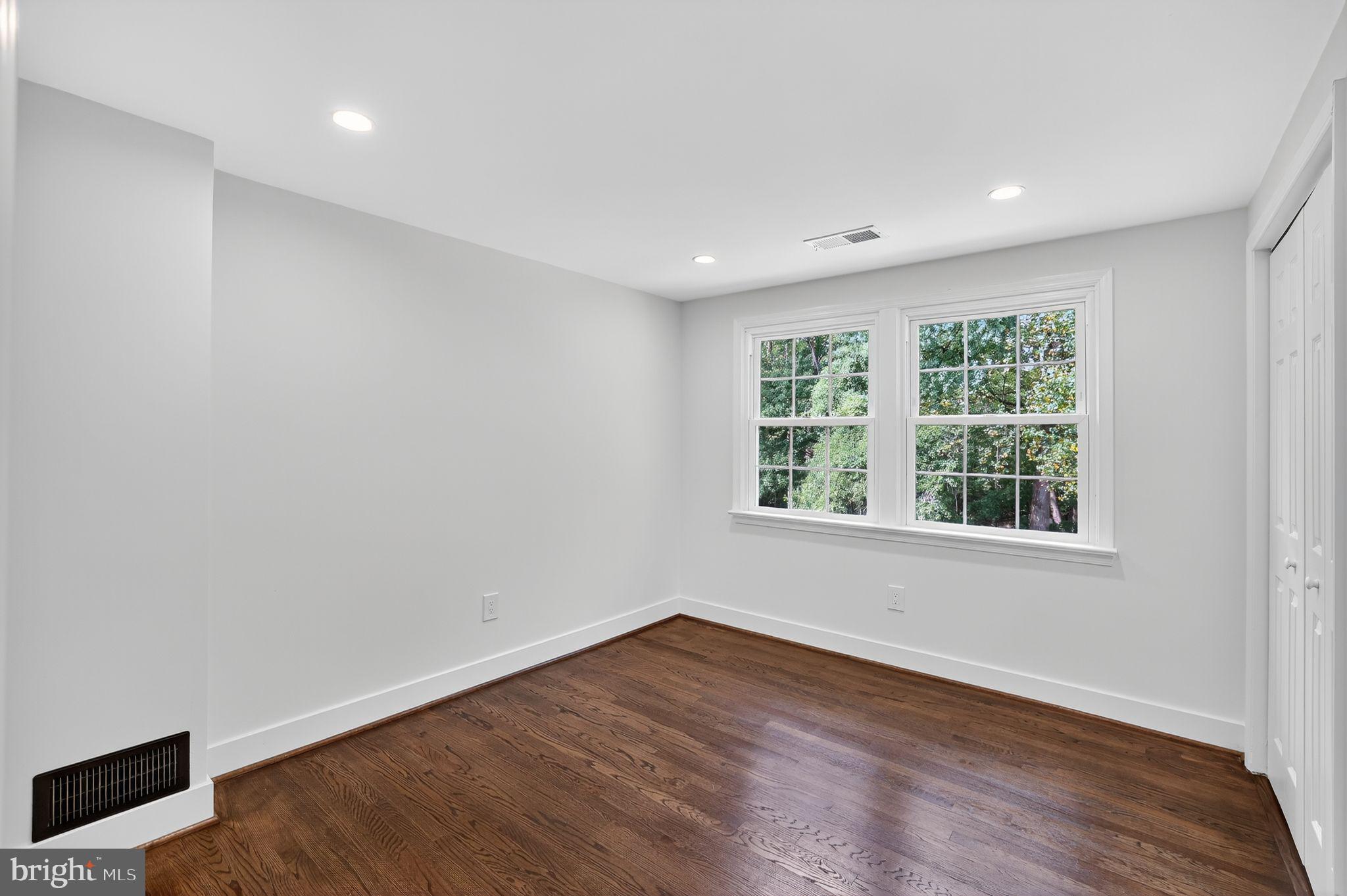 3428 Beret Lane Silver Spring, MD 20906 - Photo 22 of 33 a view of an empty room with wooden floor and a window