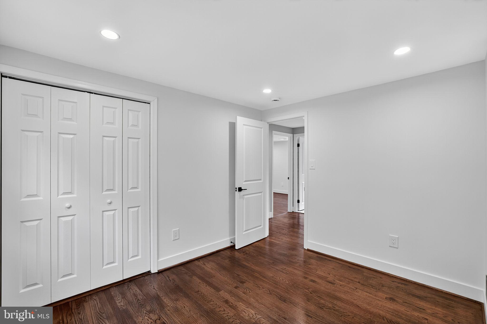 3428 Beret Lane Silver Spring, MD 20906 - Photo 23 of 33 a view of an empty room with wooden floor