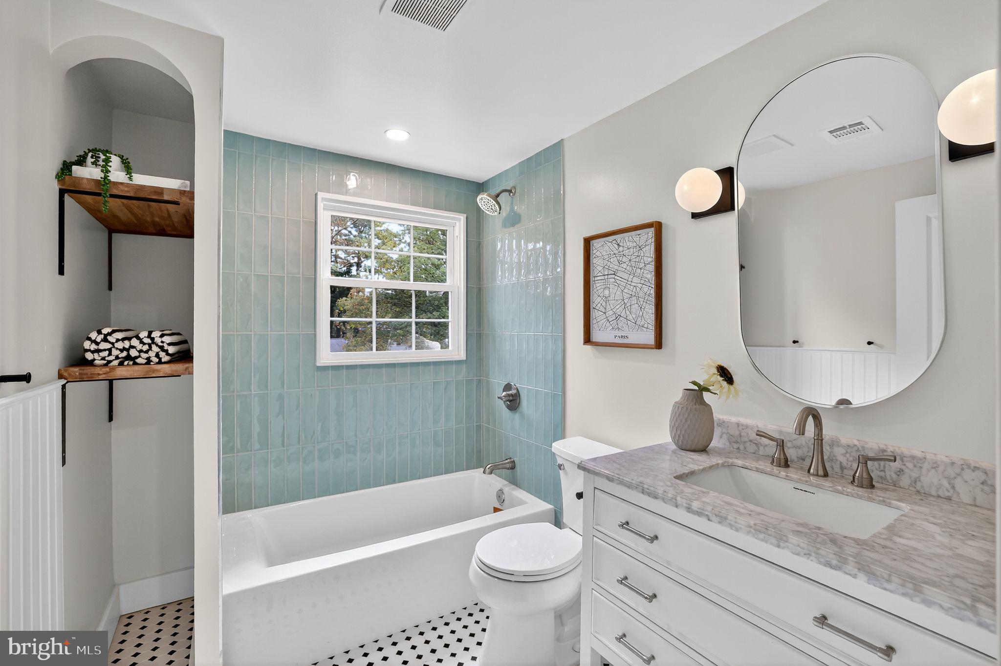 3428 Beret Lane Silver Spring, MD 20906 - Photo 28 of 33 a bathroom with a granite countertop bathtub sink vanity mirror and toilet