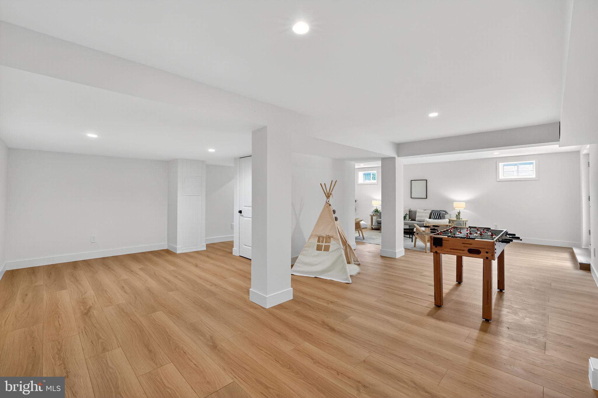 3428 Beret Lane Silver Spring, MD 20906 - Photo 31 of 33 a view of a living room and a livingroom with furniture wooden floor a ceiling fan