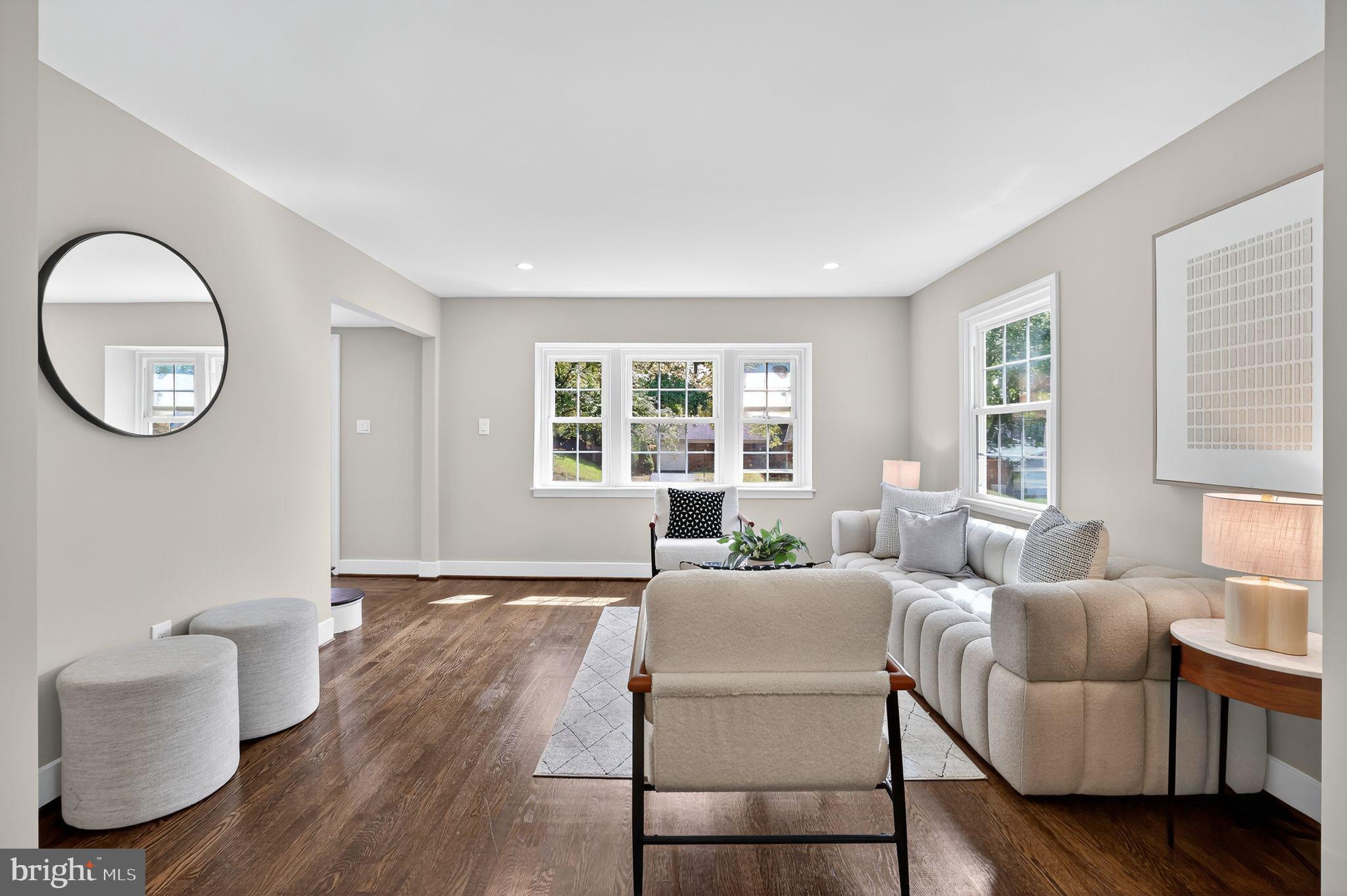 3428 Beret Lane Silver Spring, MD 20906 - Photo 4 of 33 a living room with furniture a large window and wooden floor