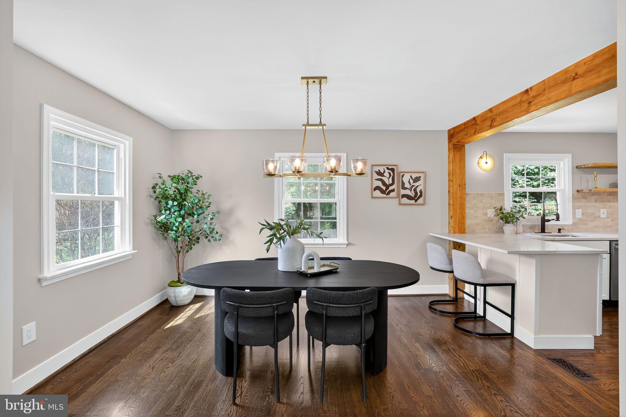 3428 Beret Lane Silver Spring, MD 20906 - Photo 5 of 33 a dining room with furniture a chandelier and wooden floor