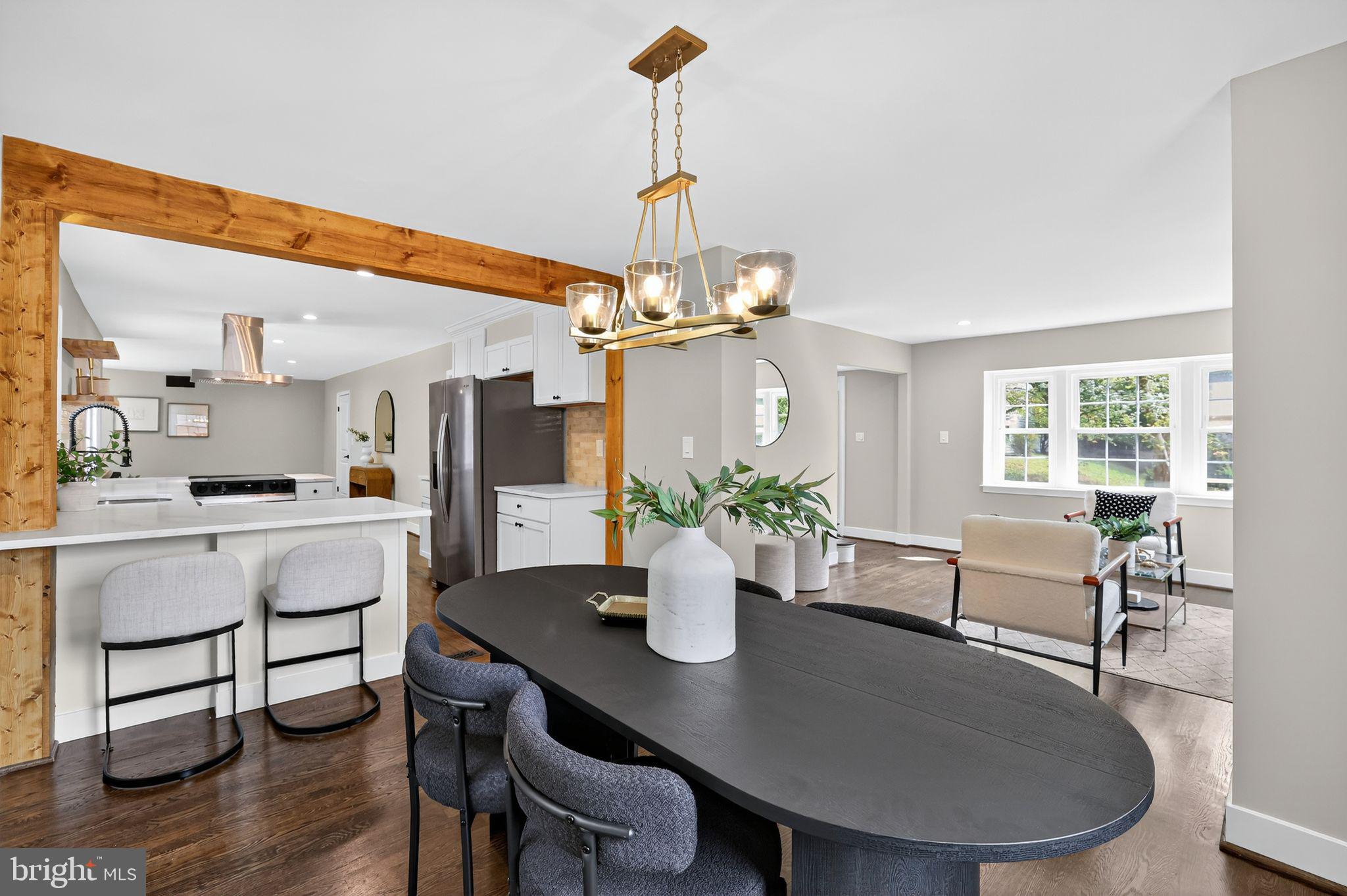 3428 Beret Lane Silver Spring, MD 20906 - Photo 6 of 33 a dining room with furniture a chandelier and wooden floor