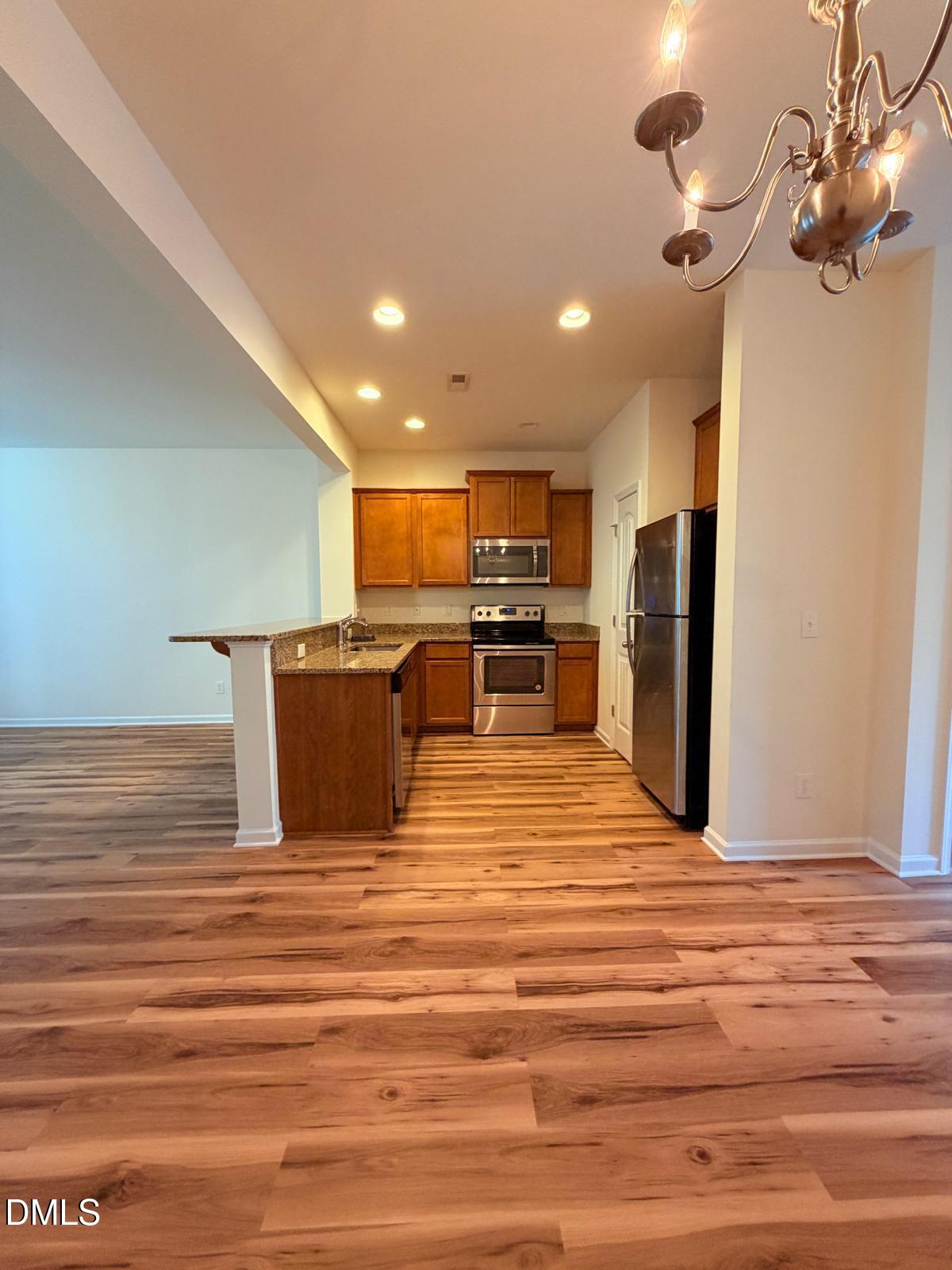 750 Maypearl Lane Raleigh, NC 27610 - Photo 4 of 18 dining to Kitchen