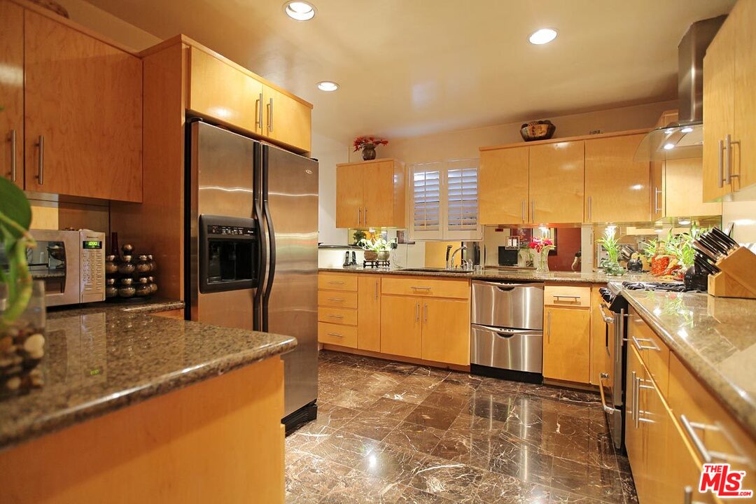 a kitchen with sink cabinets and counter