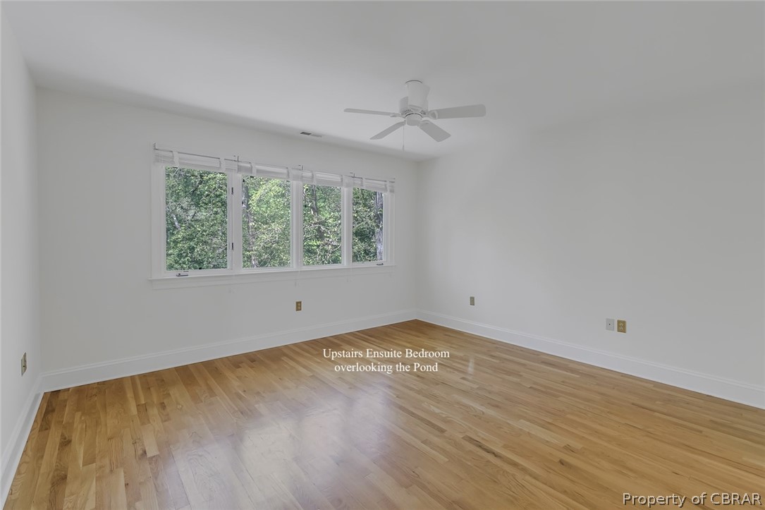5818 Rivers Landing Terrace, Unit 5818 White Stone, VA 22578 - Photo 29 of 50 Unfurnished room with light hardwood / wood-style flooring and ceiling fan