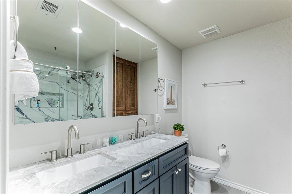 3433 Charing Cross Road Midlothian, TX 76065 - Photo 14 of 27 a bathroom with a granite countertop sink a toilet and a mirror