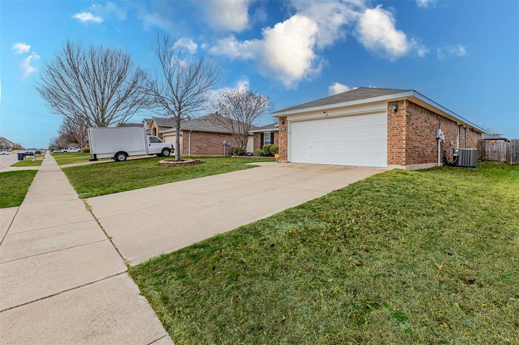 3433 Charing Cross Road Midlothian, TX 76065 - Photo 24 of 27 a front view of a house with a yard and garage