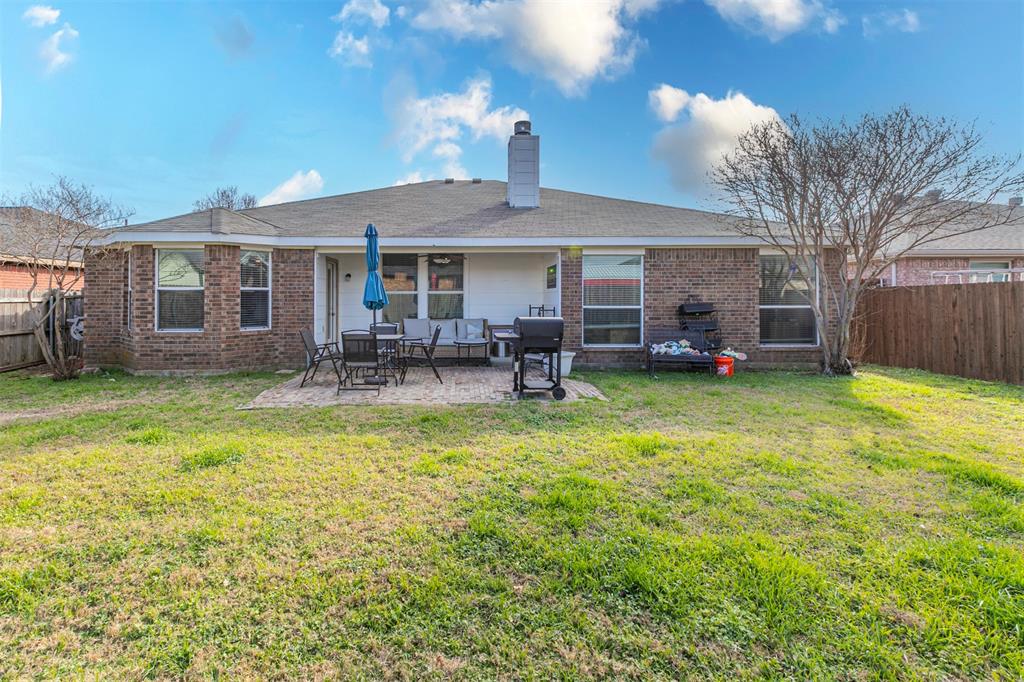 3433 Charing Cross Road Midlothian, TX 76065 - Photo 25 of 27 a front view of a house with a garden and patio