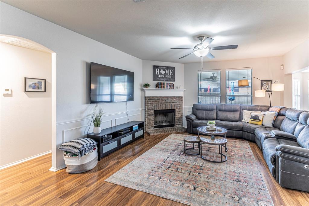 3433 Charing Cross Road Midlothian, TX 76065 - Photo 4 of 27 a living room with furniture and a fireplace