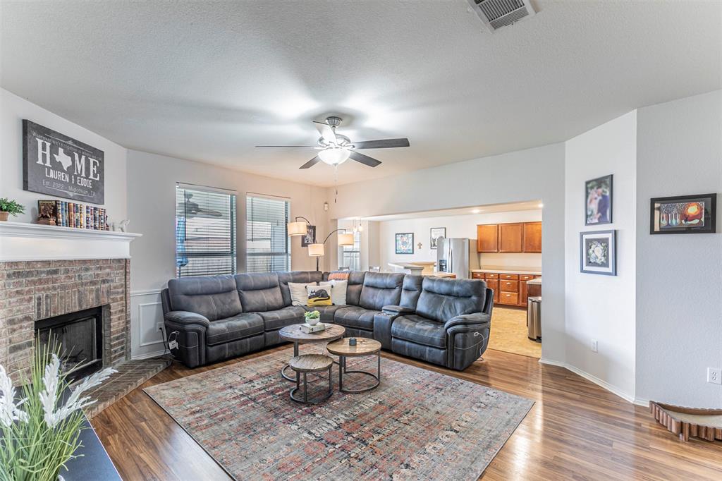 3433 Charing Cross Road Midlothian, TX 76065 - Photo 5 of 27 a living room with furniture and a fireplace